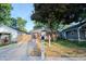 Quaint home with a brick facade, front lawn, and a neatly paved driveway at 608 Manhattan Ave, Indianapolis, IN 46241
