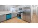 Modern kitchen featuring stainless steel appliances and sleek gray cabinets at 608 Manhattan Ave, Indianapolis, IN 46241