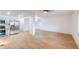 Bright, open-concept living space with wood flooring that flows into the modern kitchen at 608 Manhattan Ave, Indianapolis, IN 46241