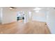 Bright, open-concept living space with wood flooring that flows into the modern kitchen at 608 Manhattan Ave, Indianapolis, IN 46241