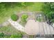 Well-maintained backyard features a pergola over a wooden deck, landscaping, and a stone pathway at 610 Front Royal Dr, Indianapolis, IN 46227
