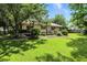 Spacious backyard with a deck and an appealing pergola for outdoor activities at 610 Front Royal Dr, Indianapolis, IN 46227