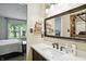 Updated bathroom boasts a natural light view and shelving, creating a calm retreat at 610 Front Royal Dr, Indianapolis, IN 46227