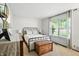 Well-lit bedroom boasts a metal bed frame and storage chest for classic comfort at 610 Front Royal Dr, Indianapolis, IN 46227
