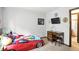 Bright bedroom features a fun race car bed and a wood desk at 610 Front Royal Dr, Indianapolis, IN 46227