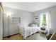 Neutral bedroom with daybed, a window with curtains, and side table at 610 Front Royal Dr, Indianapolis, IN 46227