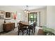Charming dining room with a wood table, decorative accents, and sliding glass door to yard at 610 Front Royal Dr, Indianapolis, IN 46227
