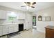 Cozy eat-in kitchen features white cabinets, a black dishwasher, and a light-filled window at 610 Front Royal Dr, Indianapolis, IN 46227