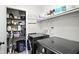 Organized laundry room features modern washer/dryer and ample storage shelves at 610 Front Royal Dr, Indianapolis, IN 46227