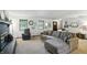 Cozy living room featuring neutral colors, plush seating, and great natural light from the surrounding windows at 610 Front Royal Dr, Indianapolis, IN 46227
