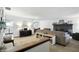Bright living room flows into dining area, featuring neutral tones and a cozy fireplace at 610 Front Royal Dr, Indianapolis, IN 46227