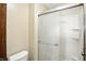 Modern shower boasts storage and sliding door, creating a serene and functional space at 610 Front Royal Dr, Indianapolis, IN 46227