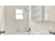 Bright bathroom with tile surround, a shower head, and window providing natural light at 6108 Penway St, Indianapolis, IN 46224
