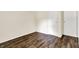 This ample bedroom offers wood-look flooring, storage closets, and neutral walls at 6108 Penway St, Indianapolis, IN 46224