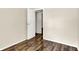 An airy room with wood-look floors, natural light, and open doorway creating a welcoming atmosphere at 6108 Penway St, Indianapolis, IN 46224