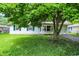Charming home with well-maintained lawn and mature tree at 6108 Penway St, Indianapolis, IN 46224