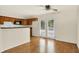 Kitchen with wood cabinets, stainless appliances, bar top and access to the backyard at 6108 Penway St, Indianapolis, IN 46224