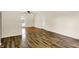 Bright living room with hardwood floors and a back door leading to the outside at 6108 Penway St, Indianapolis, IN 46224