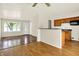 Bright living room with breakfast bar, hardwood floors, and natural light at 6108 Penway St, Indianapolis, IN 46224
