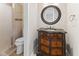Elegant bathroom with a detailed vanity, granite countertop, and tiled walk-in shower at 625 La Placita St, Greenwood, IN 46143