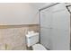 Tiled bathroom featuring a shower and toilet at 625 La Placita St, Greenwood, IN 46143