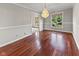 Dining room featuring wood floors, chandelier lighting, and neutral paint at 625 La Placita St, Greenwood, IN 46143