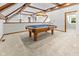 Spacious game room featuring a classic pool table, unique lighting, and bright, inviting atmosphere at 625 La Placita St, Greenwood, IN 46143