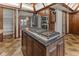 Close-up kitchen shot highlighting the island cooktop, stainless steel appliances and custom cabinetry at 625 La Placita St, Greenwood, IN 46143