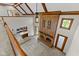 Open-concept living room featuring a fireplace and large, light-filled windows at 625 La Placita St, Greenwood, IN 46143