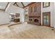 Spacious living room with fireplace, bar area, and a glimpse of the outdoor pool at 625 La Placita St, Greenwood, IN 46143