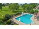 Backyard in-ground pool with slide, diving board, and basketball hoop, surrounded by mature landscaping at 625 La Placita St, Greenwood, IN 46143