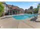 Backyard pool features a diving board and slide adjacent to the sunroom and garden at 625 La Placita St, Greenwood, IN 46143