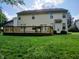 Backyard with a spacious wooden deck and lush green lawn, perfect for outdoor entertaining and relaxation at 6483 Timber Walk Dr, Indianapolis, IN 46236