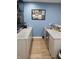 Basement bar area with granite countertops, mini-fridge and undercounter beverage cooler at 6483 Timber Walk Dr, Indianapolis, IN 46236