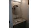 Charming bathroom featuring a modern vanity with a marble countertop and a round mirror at 6483 Timber Walk Dr, Indianapolis, IN 46236