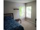 Bright bedroom with two windows and natural light and carpet at 6483 Timber Walk Dr, Indianapolis, IN 46236