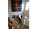 Two-story foyer with wood and iron railing, offering a view of the living space and front door at 6483 Timber Walk Dr, Indianapolis, IN 46236