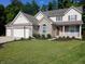 Charming two-story home with brick and siding, attached garage, and a well-manicured lawn at 6483 Timber Walk Dr, Indianapolis, IN 46236