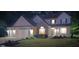 Two-story home with a brick facade and white siding, featuring a well-maintained lawn at dusk at 6483 Timber Walk Dr, Indianapolis, IN 46236