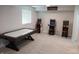 Finished basement offers classic arcade games and an air hockey table at 6483 Timber Walk Dr, Indianapolis, IN 46236