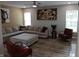 Bright living room with a large sectional sofa, hardwood floors, and modern decor at 6483 Timber Walk Dr, Indianapolis, IN 46236