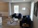 Cozy living room featuring stylish furnishings, a modern floor lamp, and ample natural light through the windows at 6483 Timber Walk Dr, Indianapolis, IN 46236