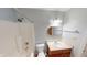 Bathroom features a shower-tub combo, single sink vanity, and sleek grey walls at 6640 Chipping Ct, Indianapolis, IN 46268