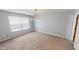 Bedroom with a chandelier, neutral walls, window, and carpeted floor at 6640 Chipping Ct, Indianapolis, IN 46268