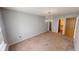 Bright bedroom featuring carpet flooring, large window, and a chandelier at 6640 Chipping Ct, Indianapolis, IN 46268