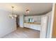 Bright kitchen with white cabinets, modern appliances, and wood-look flooring at 6640 Chipping Ct, Indianapolis, IN 46268