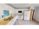 Bright kitchen with white cabinetry, laminate countertops, and modern appliances at 6640 Chipping Ct, Indianapolis, IN 46268