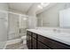 Bathroom features a double sink vanity and tiled walk-in shower at 6644 Aberdeen Dr, McCordsville, IN 46055
