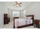 This bedroom features neutral paint, carpet, and a dark wood bedroom suite at 6644 Aberdeen Dr, McCordsville, IN 46055