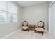 Cozy bedroom featuring neutral carpet and two vintage chairs at 6644 Aberdeen Dr, McCordsville, IN 46055